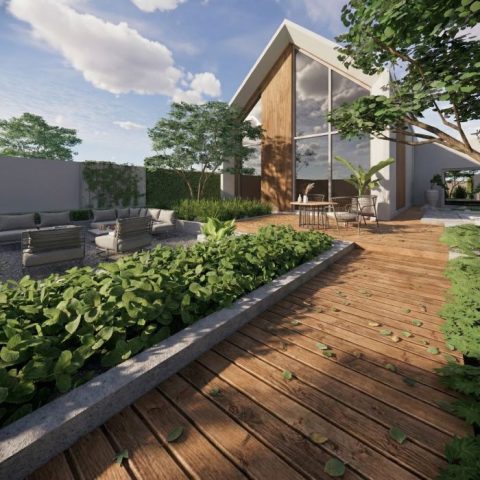 Drewniany taras przy nowoczesnym domu otoczony roślinnością i rabatami – projektowanie ogrodów i tarasów Rzeszów