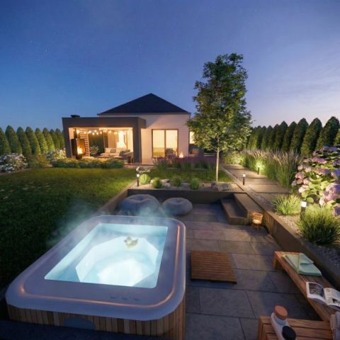 Ogród z paleniskiem – nowoczesna strefa wypoczynku z jacuzzi, rabatami żwirowymi, hortensjami i dekoracyjnym oświetleniem ogrodowym.